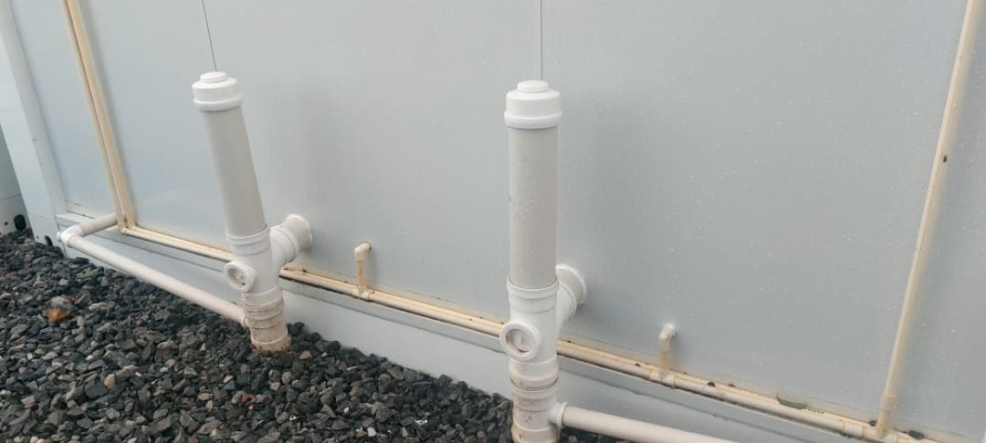 Plumbing and sanitation pipework on a modular unit