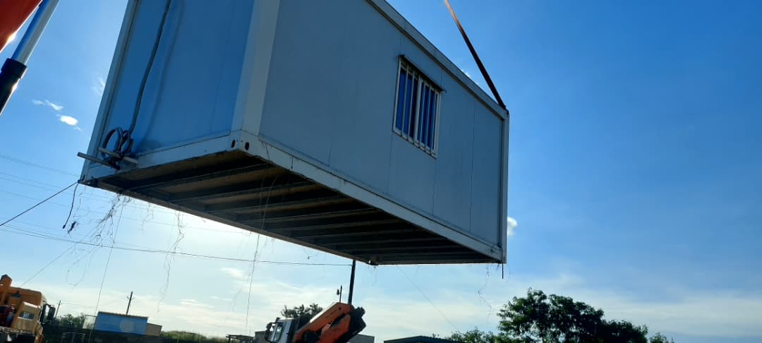 Modular unit craned into place on a construction site